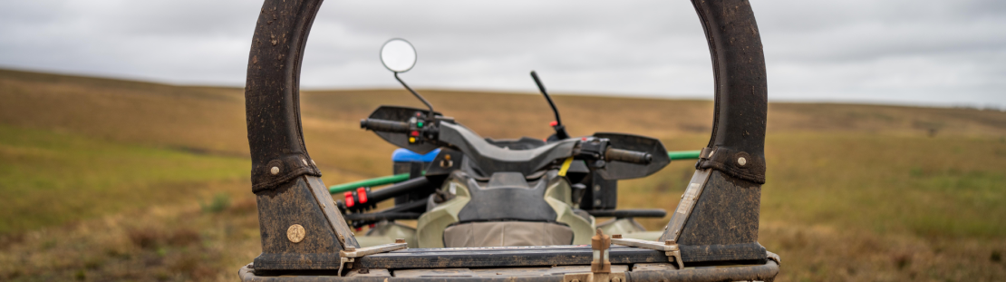 ATV on a farm zoomed in on the lifeguard roll bar