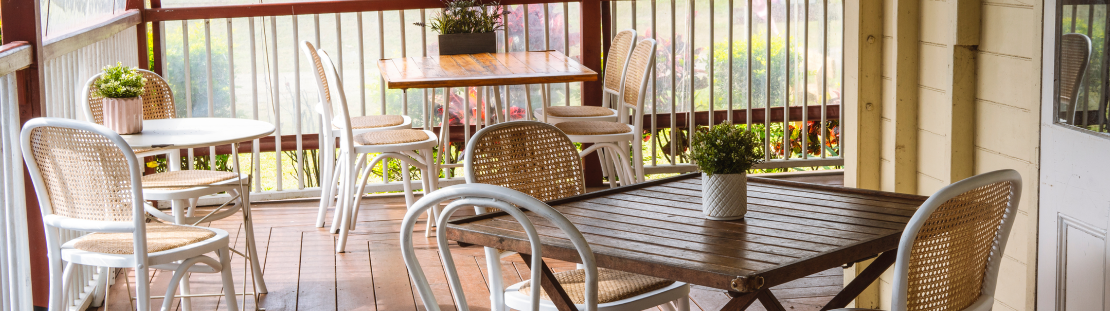 Photo of tables and chairs on a deck