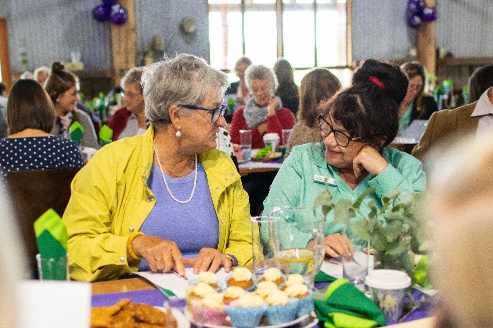 Two ladies having a chat over morning tea