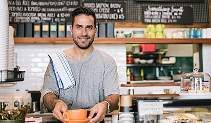 Cafe staff serving coffee