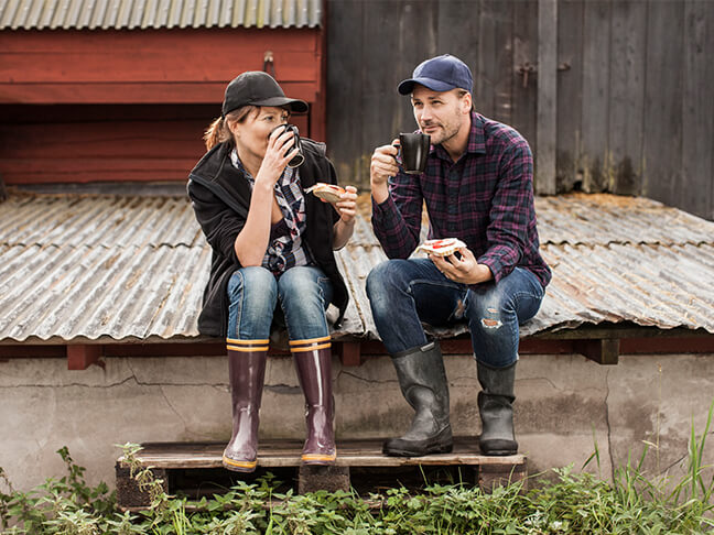 Farm couple having coffee and light snack.